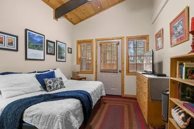 a bedroom with a bed and a television in it at Sundance - Foosball Table BBQ Near West Beach in Carnelian Bay