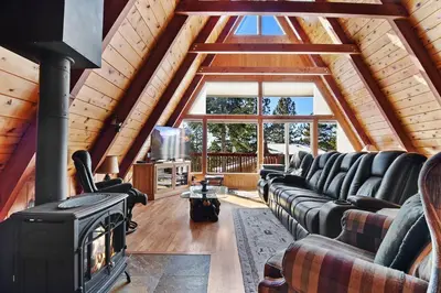 a living room with a couch and a fireplace at Beautiful Mountain Getaway in Kings Beach