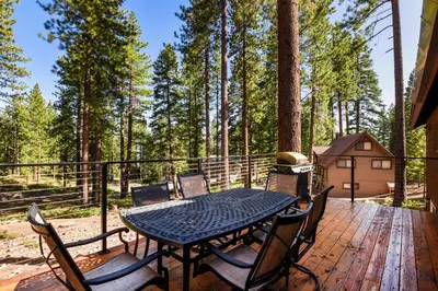 a table and chairs on a deck with a grill at Tranquil Tumbleweed - Close to Skiing & More in Incline Village
