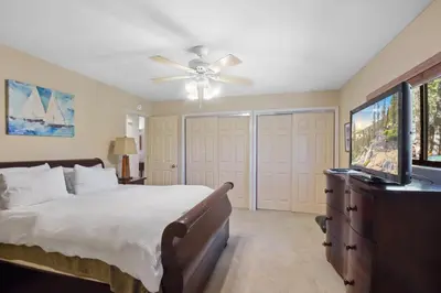 a bedroom with a bed and a flat screen tv at Tranquil Tumbleweed - Close to Skiing & More in Incline Village