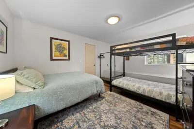 a bedroom with two bunk beds and a rug at Tranquil Tumbleweed - Close to Skiing & More in Incline Village