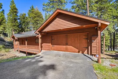 a house with a large garage with a driveway at Tranquil Tumbleweed - Close to Skiing & More in Incline Village