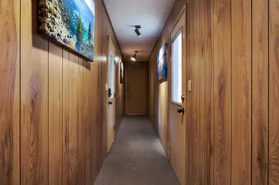 a hallway with wooden walls and a painting on the wall at Truckee Cabin Getaway - Sleeps 6 in Truckee