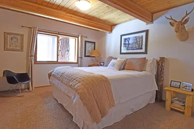 a bedroom with a large bed and a window at Vista Point - 5 Minutes to Kings Beach in Tahoe Vista