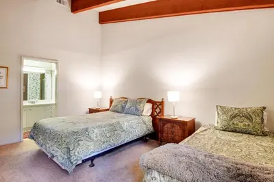 a bedroom with two beds and a window at Waters Edge Escape - Patio with BBQ Near Beach in Tahoma