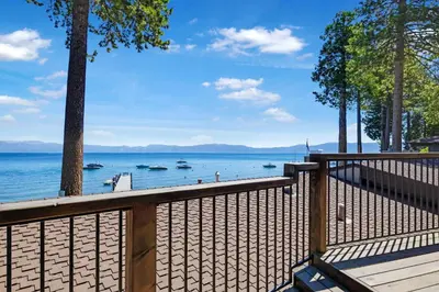 a wooden deck with a view of the water at Waters Edge Jewel with Lake Views - HOA Access in Tahoma