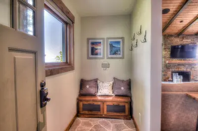 a home hallway with a bench and a window at Waters Edge Jewel with Lake Views - HOA Access in Tahoma