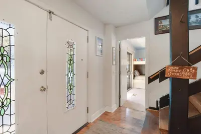 a hallway with a door with a stained glass window at Woodside Hideout - Hop Away from Activities in Tahoma