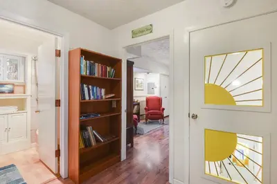a room with a door with a window and a chair at Woodside Hideout - Hop Away from Activities in Tahoma