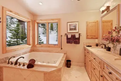 a large bathroom with a tub and a sink at Wulf's Lodge at Olympic Valley - Unwind in Hot Tub in Olympic Valley