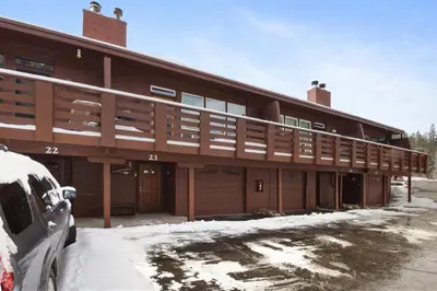 a large building with snow in front of it at Alpine Manor Retreat Mountain Relaxation in Alpine Meadows