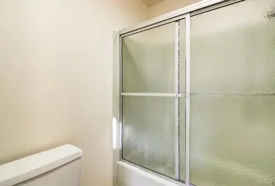a glass shower in a bathroom with a toilet at Alpine Meadows Peak 15 Min to Commons Beach in Alpine Meadows