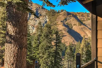 a mountain view from a house with a tree at Alpine Meadows Peak 15 Min to Commons Beach in Alpine Meadows