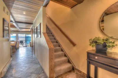 a staircase in a house with a mirror at Brockway Springs Lodge Steps to Lake Access in Kings Beach