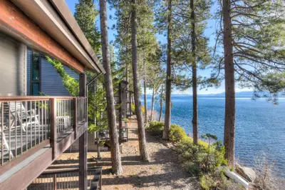 a porch of a house with a view of the water at Brockway Springs Lodge Steps to Lake Access in Kings Beach