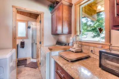 a kitchen with a counter and a window and a sink at Chamberland Getaway Lake Views with Deck in Tahoma
