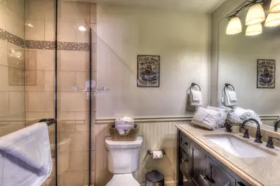 a bathroom with a shower and a toilet and a sink at Granlibakken Retreat Near Tahoe Beach in Tahoe City