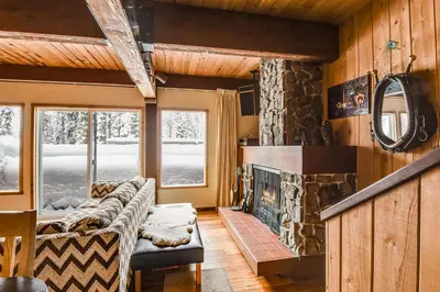 a living room with a couch and a fireplace at Comfy Alpine Meadows Endless fun in Alpine Meadows