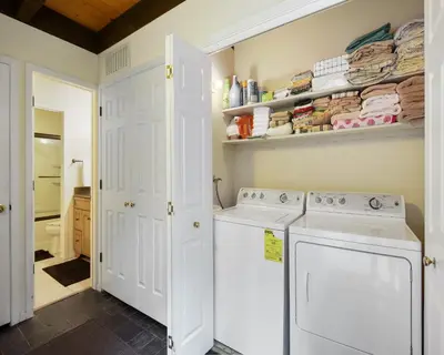 a laundry room with a washer and dryer at Enjoy Forest Views Retreat at Kingswood Village in Kings Beach