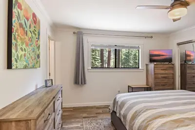 a bedroom with a bed and a window at Incline Bliss Dreamy Pet Friendly Escape in Incline Village