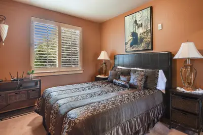 a bedroom with a large bed and a window at Crystal Charm Amazing 3 BDR Condo Close to Beaches Casinos & Skiing in Crystal Bay
