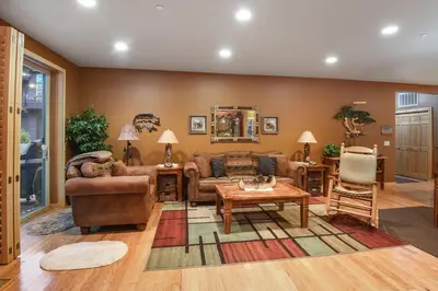 a living room with couches and a table at Crystal Charm Amazing 3 BDR Condo Close to Beaches Casinos & Skiing in Crystal Bay