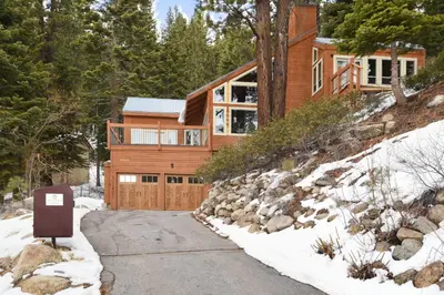 a house on a snowy hill with a driveway at Incline Village Manor Near Beach & More in Incline Village
