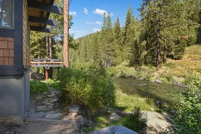 a view of a river from the side of a house at Joy on the River Stunning Waterfront Home for 10 in Olympic Valley