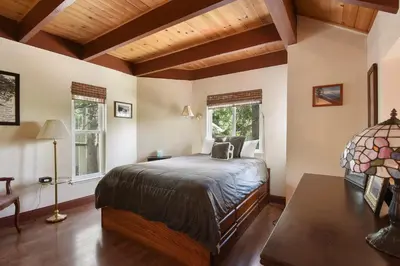 a bedroom with a bed and two windows at Tahoe City Getaway Minutes from Lake and Activities in Tahoe City