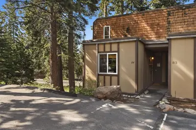 a small house with a garage next to trees at Tahoe City Getaway Minutes from Lake and Activities in Tahoe City