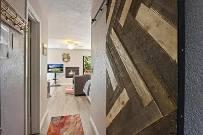 a living room with a large painting on the wall at Kings Run Retreat Patio in Tahoe Vista