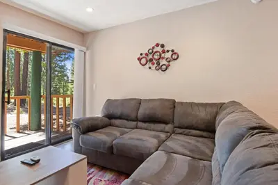 a living room with a couch and a table at Kings Run Retreat Patio in Tahoe Vista