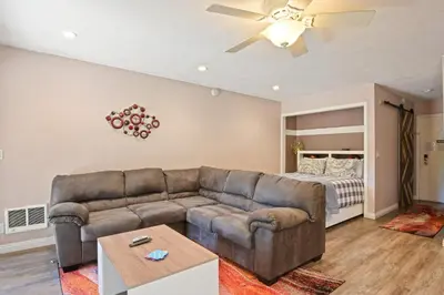 a living room with a couch and a bed at Kings Run Retreat Patio in Tahoe Vista