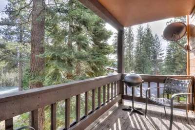 a balcony with a view of a tree at Lake Forest Villa Patio w BBQ in Tahoe City