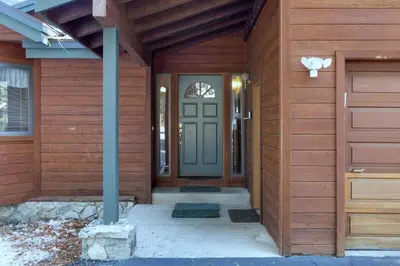a front door of a house with a blue door at Lakeview Hideaway 3BDR for 8 w Private Hot Tub in Carnelian Bay