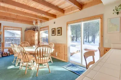 a dining room with a table and chairs at McKinney Estate w Roof Deck Beach & Hike in Tahoma