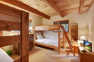 a bedroom with two bunk beds and a desk at Lake Tahoe Treasure Minutes from Beach & Skiing in Tahoma