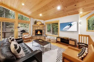 a living room with a couch and a fireplace at Modern Lake Tahoe Retreat Ski and Swim in Tahoe Vista