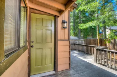 a green door on the side of a house at Moose Manor w BBQ Near Tahoe Hiking in Tahoma