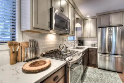 a kitchen with a sink and a stove top oven at Moose Manor w BBQ Near Tahoe Hiking in Tahoma