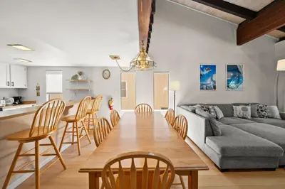 a living room and kitchen with a table and chairs at Mountain Shadows Chalet Tahoe Fun Awaits in Incline Village