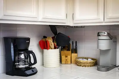 a kitchen counter with a coffee maker and utensils at Heavenly Haven - Hot Tub and Seasonal HOA Pool in Zephyr Cove