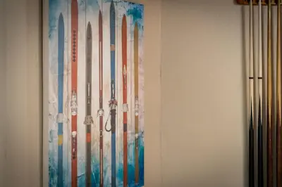 a painting of skis hanging on a wall at Heavenly Haven - Hot Tub and Seasonal HOA Pool in Zephyr Cove