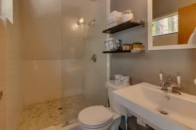 a bathroom with a toilet and a sink at Heavenly Hollow in South Lake Tahoe