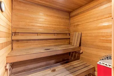 a wooden sauna with a wooden bench in it at Lakeland Getaway - Walk to Lake in South Lake Tahoe