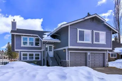 a gray house with snow in front of it at Lucerne Lake House - Ski Lease 30plus Days in South Lake Tahoe