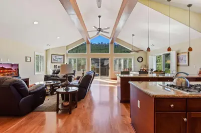 a large living room with a ceiling with a large window at Mule Meadows - Classy Split level South Tahoe home in South Lake Tahoe