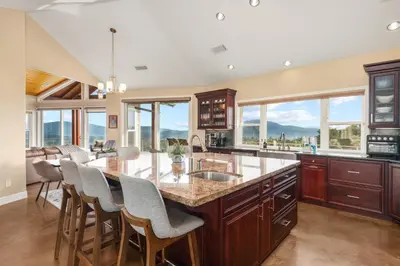 a kitchen with a large island with a counter top at Yosemite Cloudline Ridge in Oakhurst