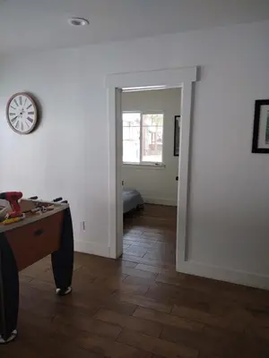 a room with a desk and a clock on the wall at Amachen Cabin - Pet & Family Friendly - woof woof in South Lake Tahoe