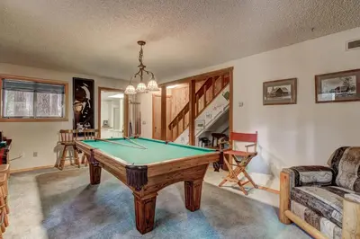 a living room with a pool table in it at Bear Haus - Fur babies welcome in South Lake Tahoe